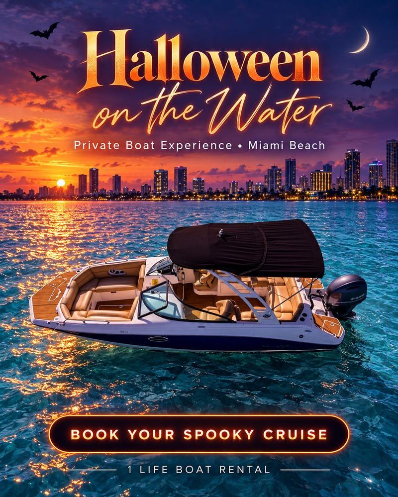 Halloween boat party Miami Beach: private yacht silhouetted against an orange sunset and the Miami skyline on Biscayne Bay