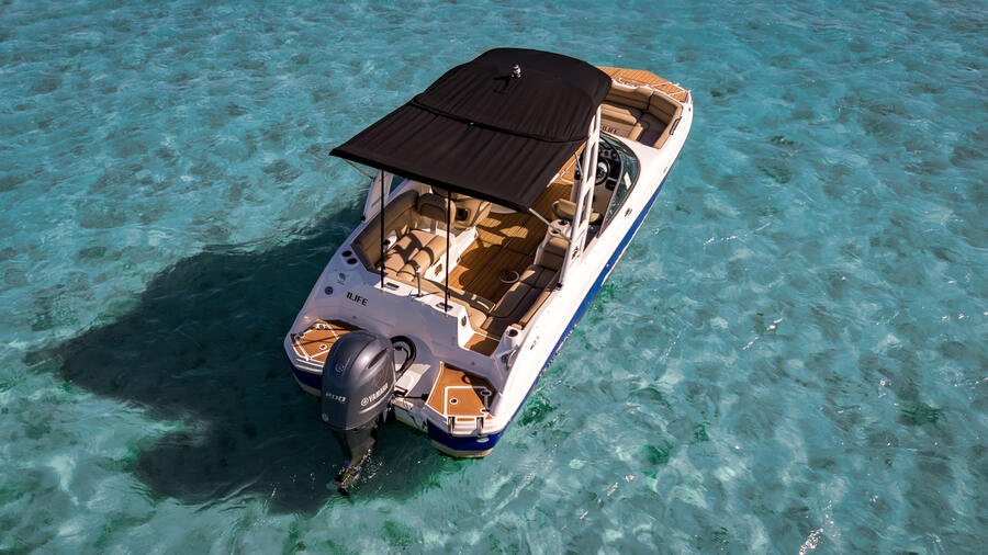 1 Life Boat Rental Nautic Star anchored in shallow clear water near a Miami mangrove island
